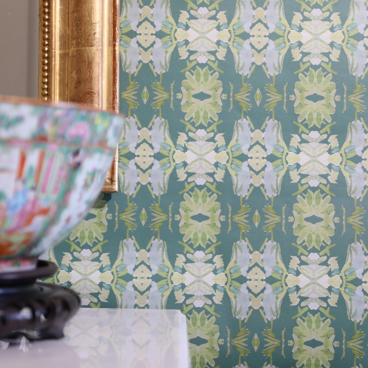 Luxury abstract floral wallpaper in rich dark green tones with layered organic movement, designed for modern traditional and collected interiors.