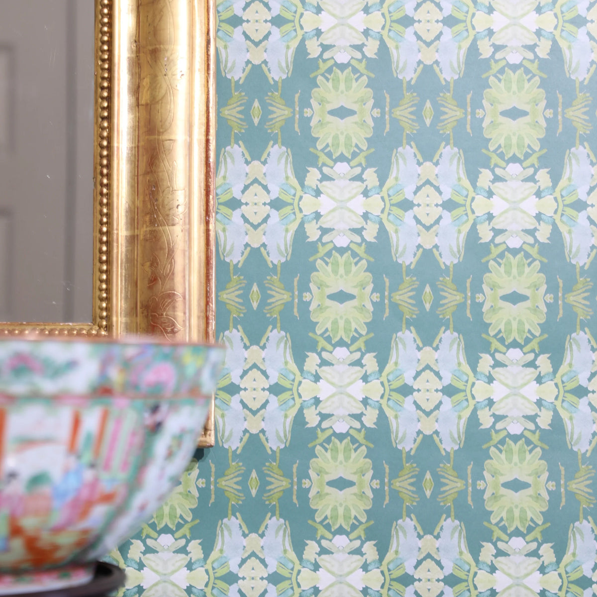 Luxury abstract floral wallpaper in rich dark green tones with layered organic movement, designed for modern traditional and collected interiors.