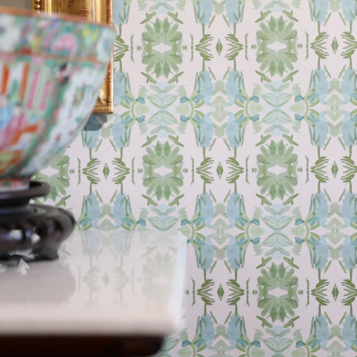 Luxury botanical wallpaper featuring an artistic wildflower-inspired pattern in sage green and soft blue, designed for modern traditional interiors, powder rooms, bedrooms, dining rooms, and collected homes.