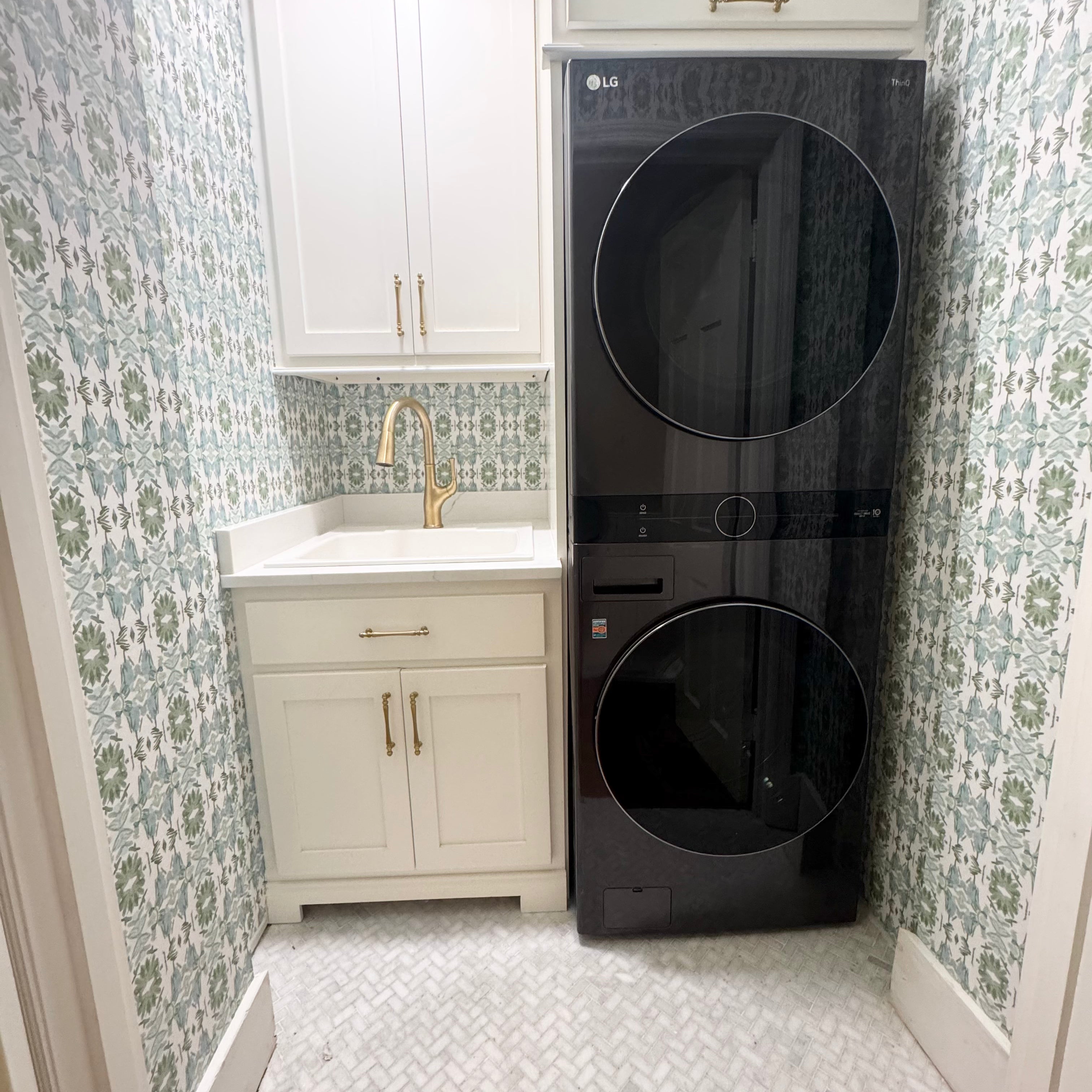 Luxury botanical wallpaper featuring an artistic wildflower-inspired pattern in sage green and soft blue, designed for modern traditional interiors, powder rooms, laundry rooms, bedrooms, dining rooms, and collected homes.