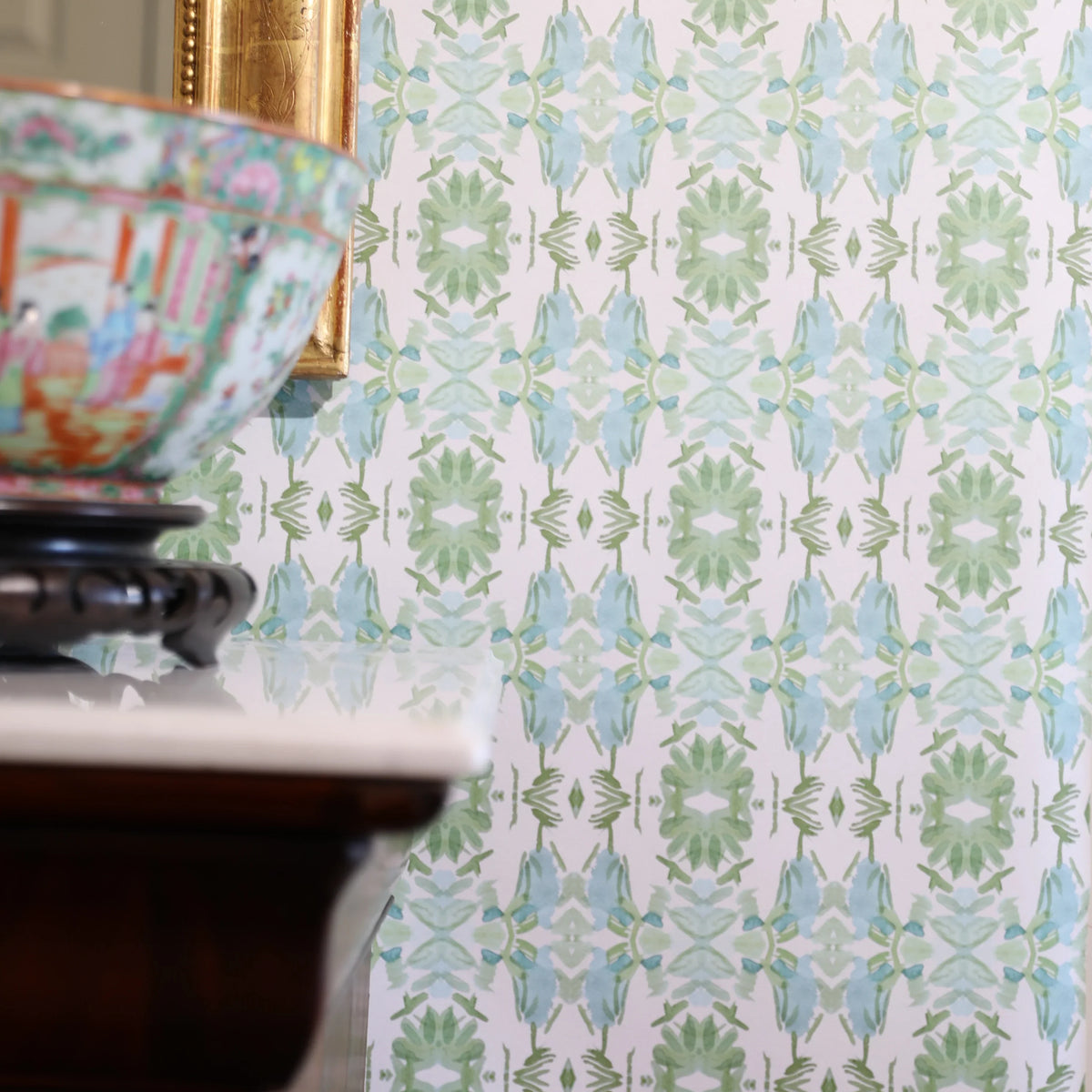 Luxury botanical wallpaper featuring an artistic wildflower-inspired pattern in sage green and soft blue, designed for modern traditional interiors, powder rooms, bedrooms, dining rooms, and collected homes.