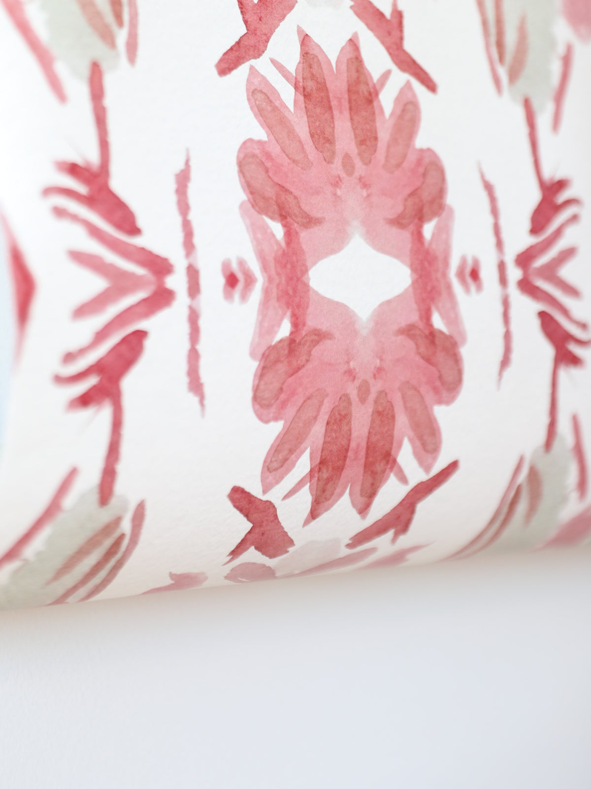 Luxury floral wallpaper featuring an artistic wildflower pattern in strawberry pink, blush, and soft green tones, designed for modern traditional interiors, bedrooms, powder rooms, and collected homes.