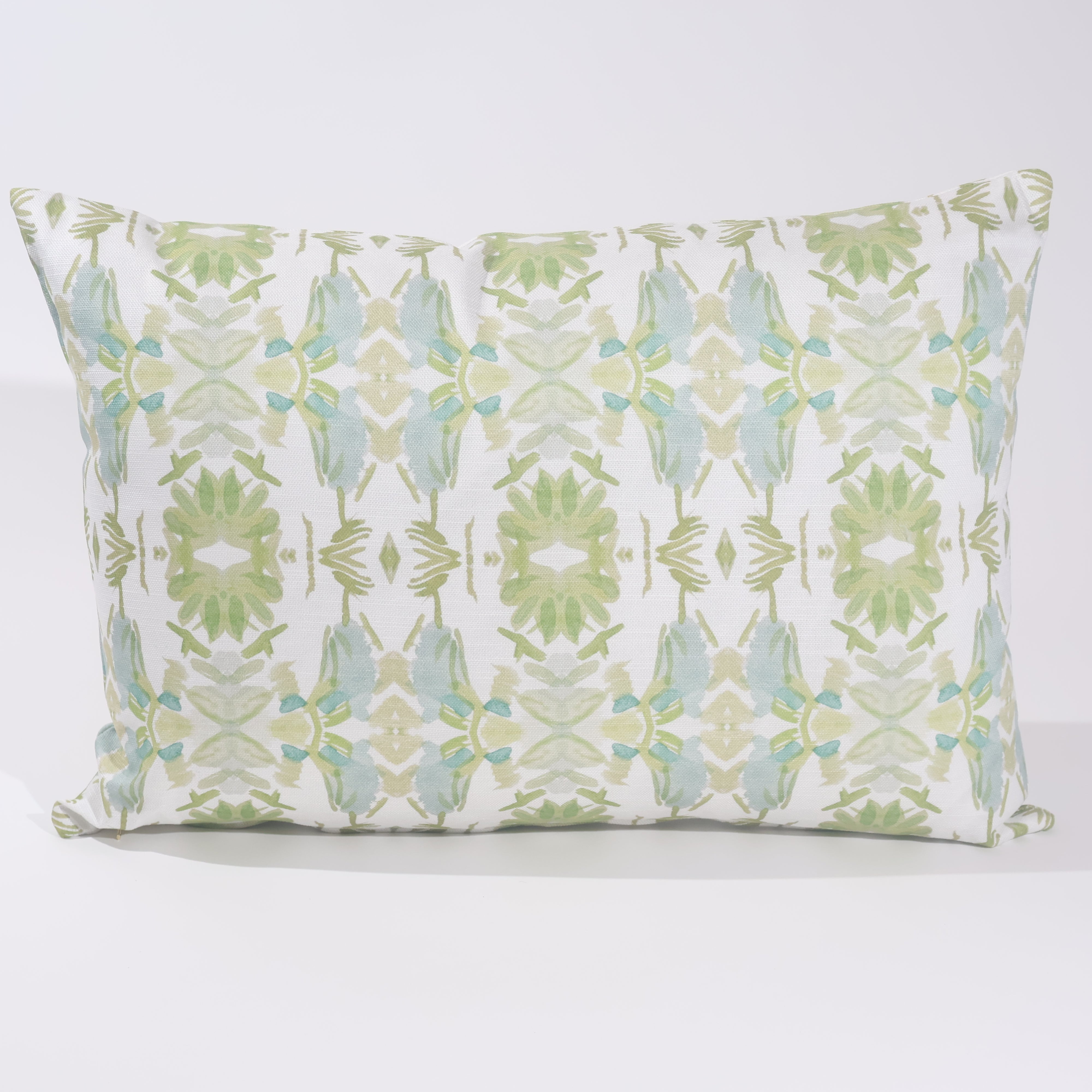 Wildflowers I White & Apple Green luxury pillow featuring an artistic floral pattern on a soft white ground, handcrafted in England for traditional, modern traditional, and layered interior design projects.