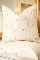 Centerpiece White Hydrangea luxury decorative pillow featuring a large-scale abstract floral pattern in layered white, cream, and deep olive green tones, handcrafted in England for luxury living rooms, designer-curated interiors, tailored upholstery, and thoughtfully layered homes.