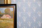 Luxury botanical wallpaper featuring a blue and white eucalyptus pattern, perfect for modern traditional interiors, coastal homes, powder rooms, bedrooms, and collected spaces.