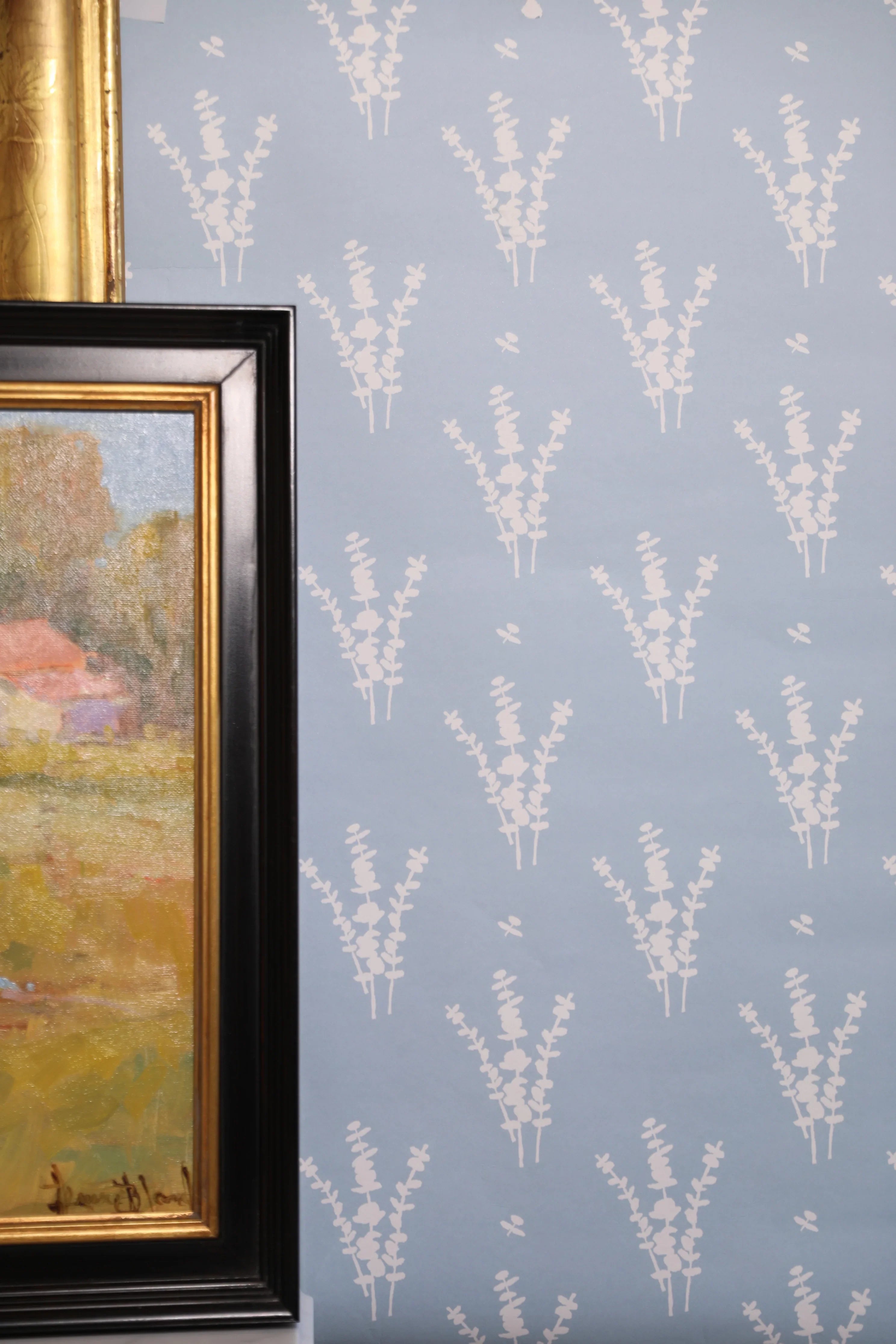 Luxury botanical wallpaper featuring a blue and white eucalyptus pattern, perfect for modern traditional interiors, coastal homes, powder rooms, bedrooms, and collected spaces.
