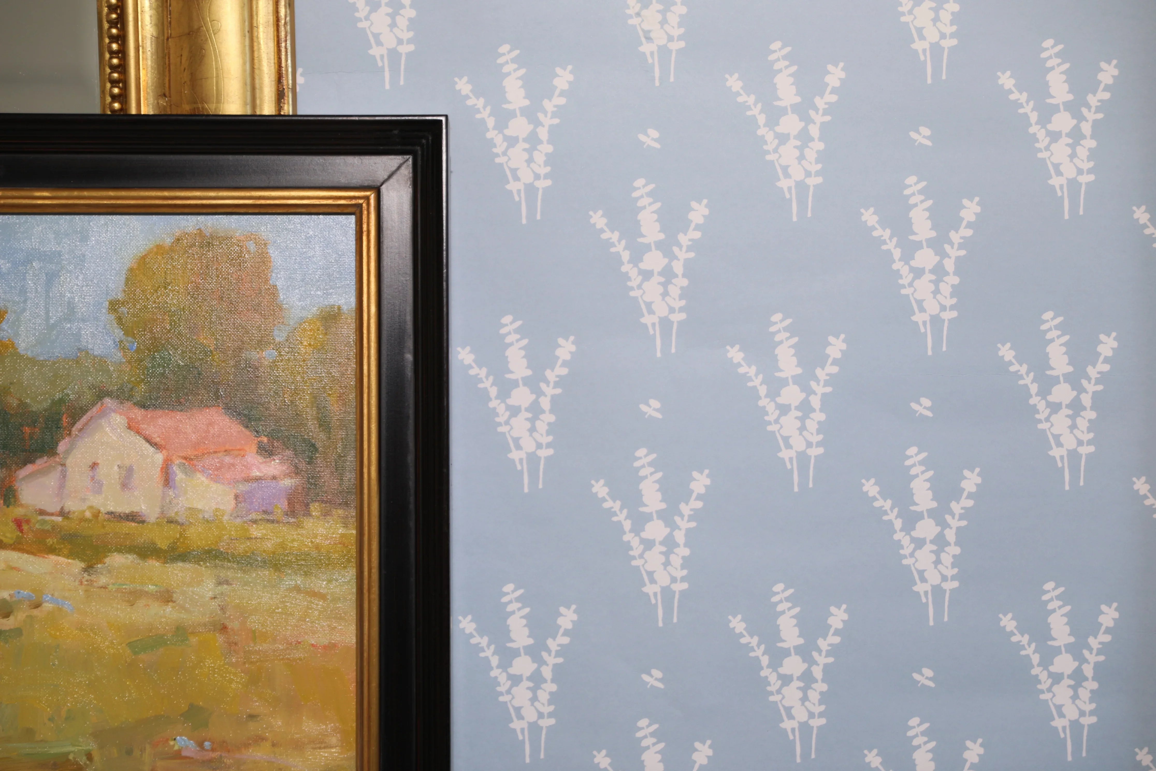 Luxury botanical wallpaper featuring a blue and white eucalyptus pattern, perfect for modern traditional interiors, coastal homes, powder rooms, bedrooms, and collected spaces.