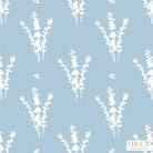 Luxury botanical wallpaper featuring a blue and white eucalyptus pattern, perfect for modern traditional interiors, coastal homes, powder rooms, bedrooms, and collected spaces.