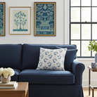 Luxury decorative pillow featuring flowing ginkgo leaf patterns in colonial blue and soft neutral tones, styled for a layered modern traditional interior.