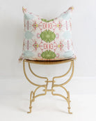 Pink Dogwoods luxury pillow featuring a large-scale abstract floral pattern in pink, soft blue, and grass green tones, handcrafted in England for layered designer interiors and luxury homes.