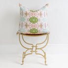 Pink Dogwoods luxury pillow featuring a large-scale abstract floral pattern in pink, soft blue, and grass green tones, handcrafted in England for layered designer interiors and luxury homes.