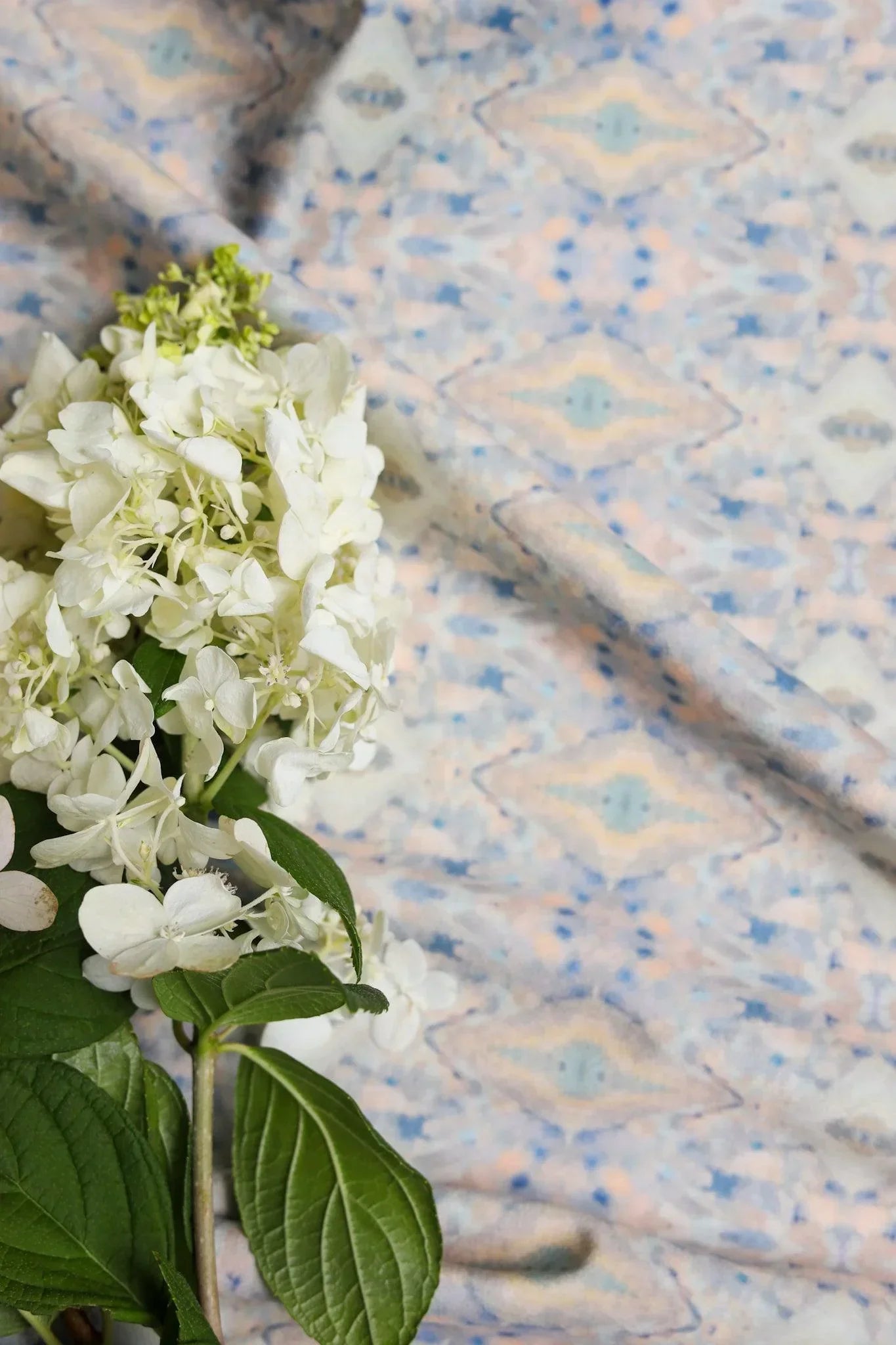 Luxury abstract fabric with layered organic movement inspired by Colorado River rock, designed for upholstery, drapery, bedding, and modern traditional interiors. Small-scale repeat with soft tonal variation and natural texture for collected luxury homes. Sustainably printed and handcrafted in England by Truett