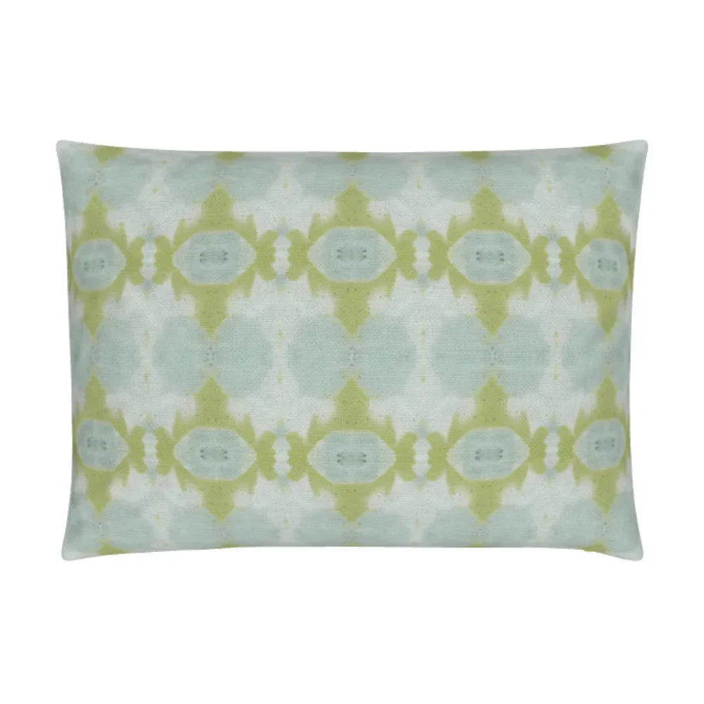Luxury decorative pillow featuring an abstract small repeat pattern in chartreuse green and soft blue tones, styled for a layered modern traditional interior.