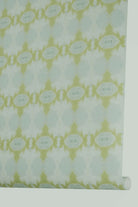 Designer abstract wallpaper in chartreuse green and soft blue with an organic geometric motif, ideal for modern traditional interiors, statement walls, and layered homes.