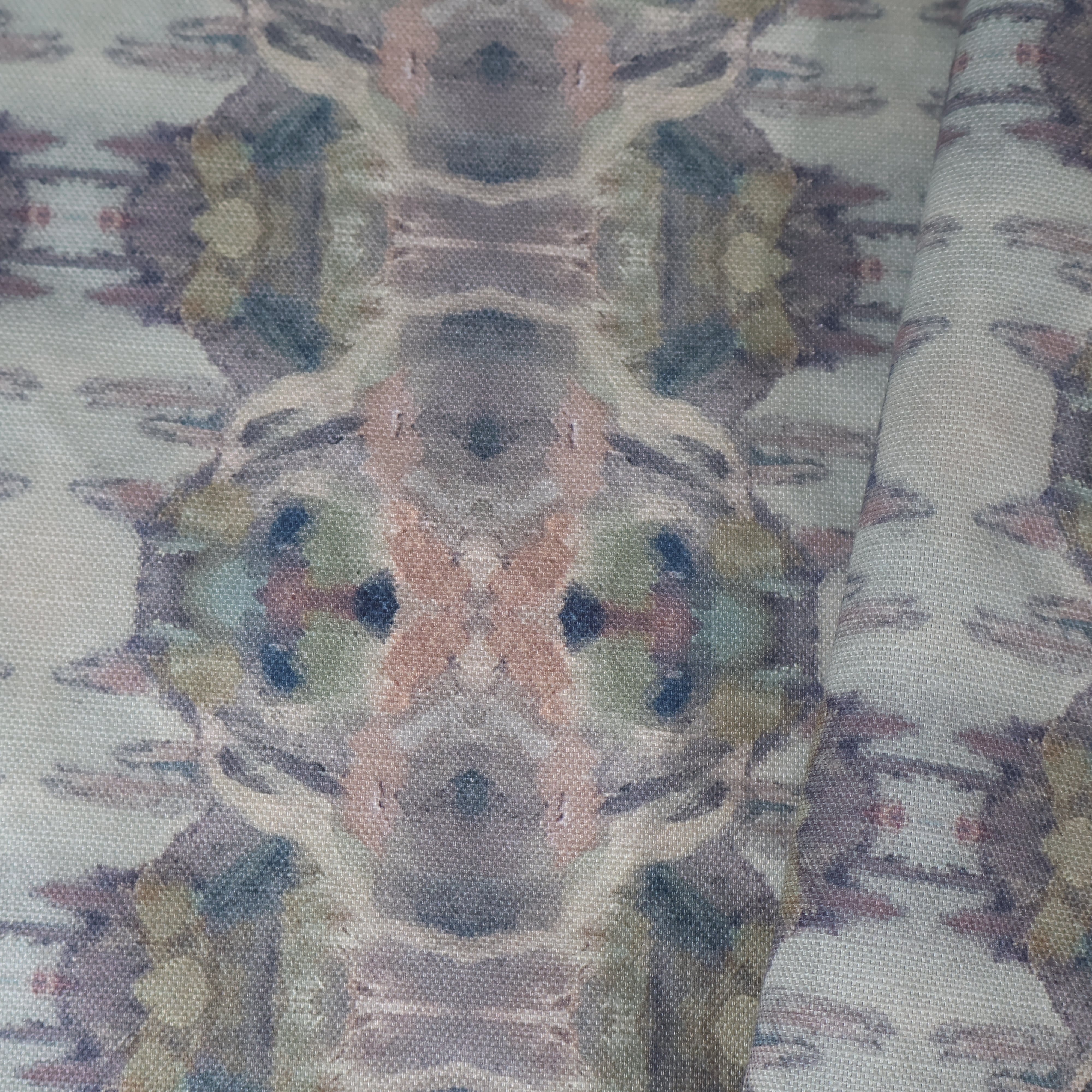 Luxury abstract fabric featuring flowing landscape-inspired movement in warm dusty neutral tones with hidden fox details for collected modern traditional interiors.