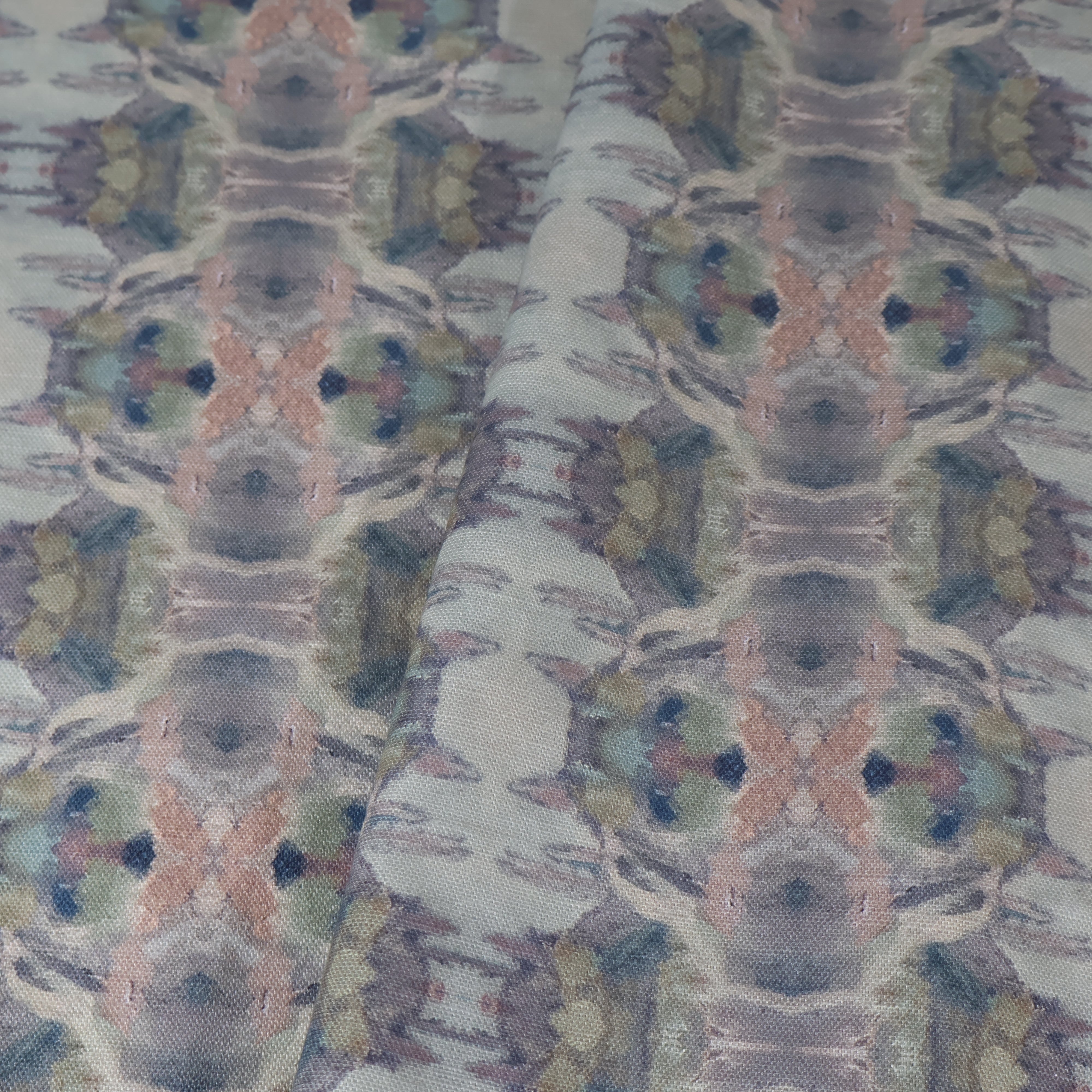 Luxury abstract fabric featuring flowing landscape-inspired movement in warm dusty neutral tones with hidden fox details for collected modern traditional interiors.
