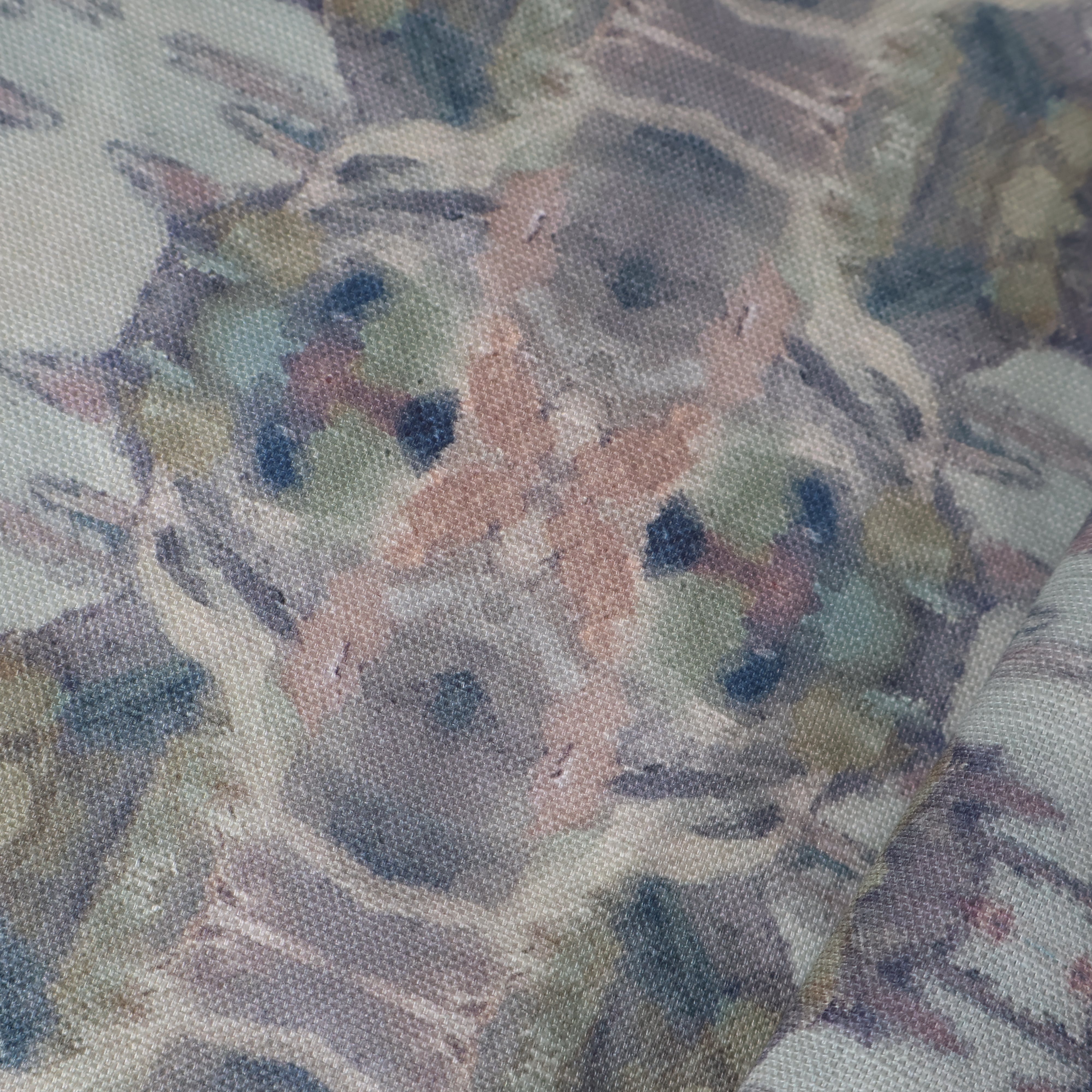 Luxury abstract fabric featuring flowing landscape-inspired movement in warm dusty neutral tones with hidden fox details for collected modern traditional interiors.