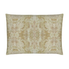 Luxury decorative pillow featuring an abstract topiary-inspired pattern in warm autumn gold and neutral tones, styled for a layered modern traditional interior.