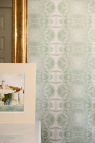 Luxury abstract jade green wallpaper with layered organic movement inspired by live oak trees, ideal for modern traditional interiors, luxury bedrooms, powder rooms, dining spaces, and collected contemporary homes. Sustainably printed in England by Truett Designs.