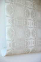 luxury abstract neutral wallpaper in soft putty tones with layered organic movement inspired by live oak trees, designed for modern traditional interiors, luxury bedrooms, powder rooms, dining spaces, and collected contemporary homes. Sustainably printed in England by Truett Designs.