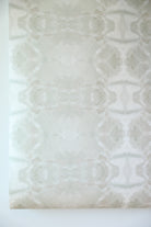 luxury abstract neutral wallpaper in soft putty tones with layered organic movement inspired by live oak trees, designed for modern traditional interiors, luxury bedrooms, powder rooms, dining spaces, and collected contemporary homes. Sustainably printed in England by Truett Designs.
