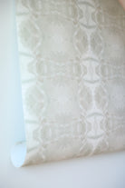 luxury abstract neutral wallpaper in soft putty tones with layered organic movement inspired by live oak trees, designed for modern traditional interiors, luxury bedrooms, powder rooms, dining spaces, and collected contemporary homes. Sustainably printed in England by Truett Designs.