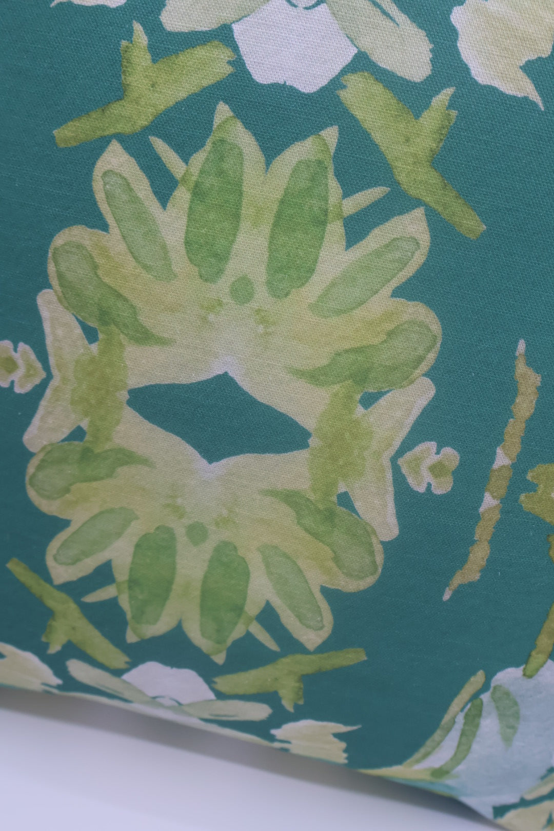 Wildflowers I Dark Green luxury pillow featuring a large-scale abstract floral pattern in rich green tones, handcrafted in England for layered designer interiors, luxury living rooms, and thoughtfully curated home