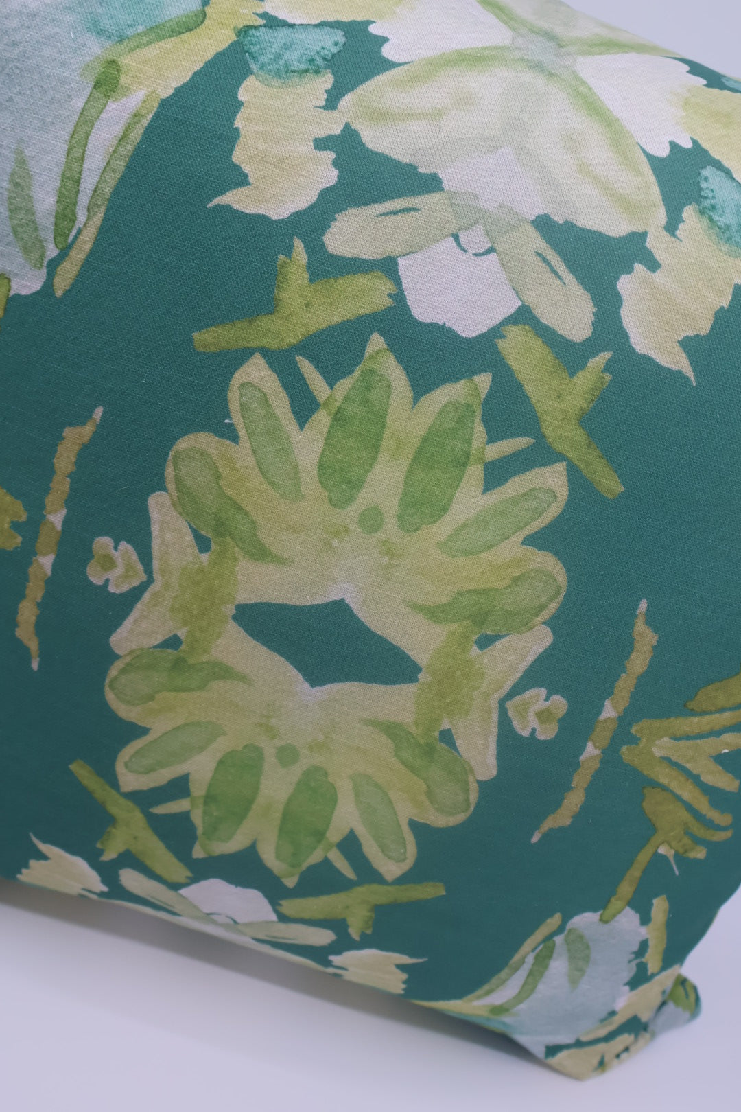 Wildflowers I Dark Green luxury pillow featuring a large-scale abstract floral pattern in rich green tones, handcrafted in England for layered designer interiors, luxury living rooms, and thoughtfully curated home