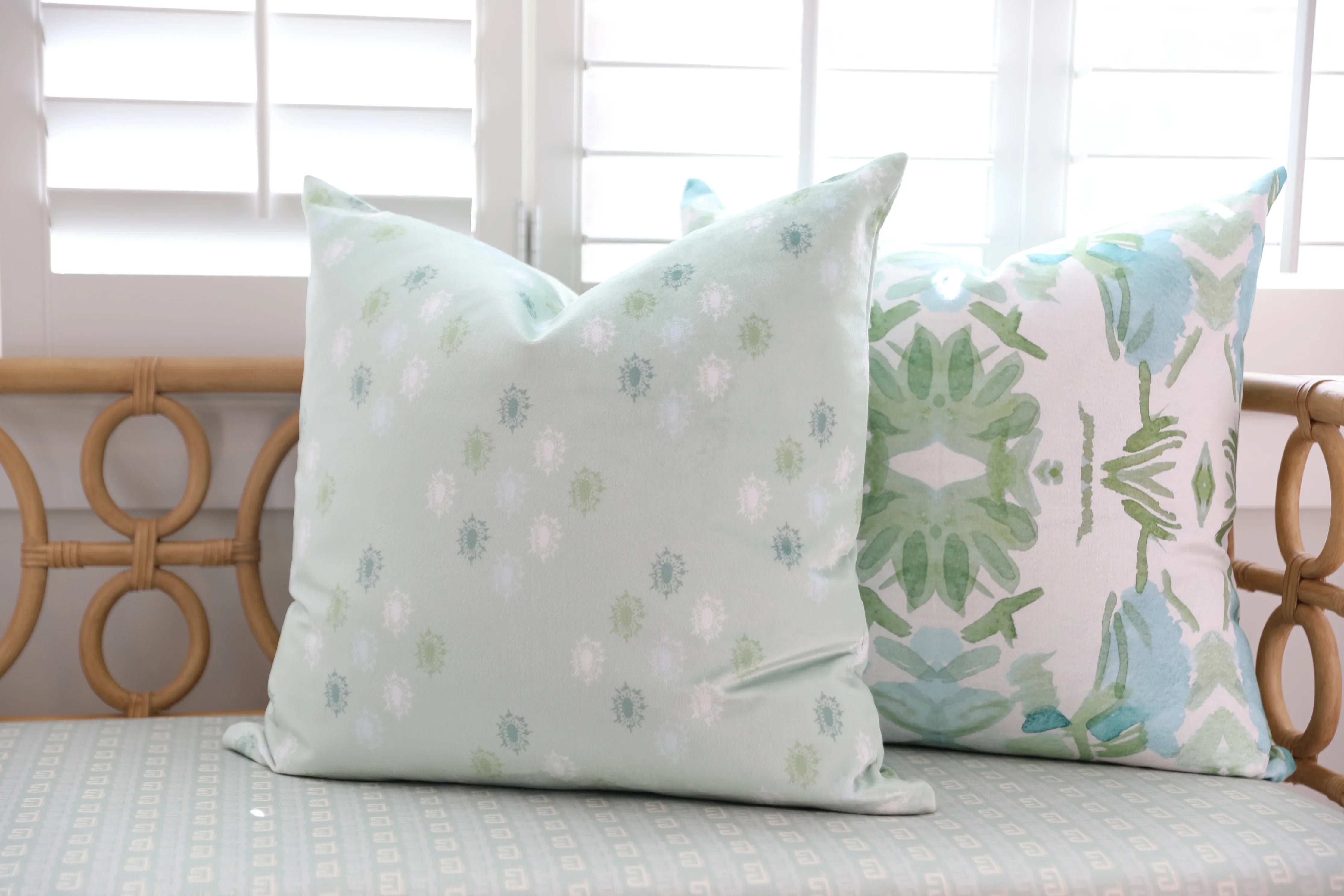 Luxury sage green and blue botanical pillow with large-scale floral pattern inspired by Alaska wildflowers, handcrafted in England and styled for contemporary and traditional interiors.