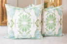 Luxury sage green and powder blue botanical pillow with large-scale floral pattern inspired by Alaska wildflowers, handcrafted in England and styled for contemporary and traditional interiors.