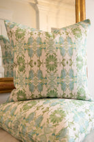 Luxury sage green and powder blue botanical pillow with large-scale floral pattern inspired by Alaska wildflowers, handcrafted in England and styled for contemporary and traditional interiors.