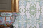Luxury botanical wallpaper featuring an artistic wildflower-inspired pattern in sage green and soft blue, designed for modern traditional interiors, powder rooms, bedrooms, dining rooms, and collected homes.