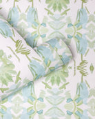 Luxury botanical wallpaper featuring an artistic wildflower-inspired pattern in sage green and soft blue, designed for modern traditional interiors, powder rooms, bedrooms, dining rooms, and collected homes.