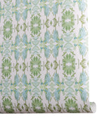 Luxury botanical wallpaper featuring an artistic wildflower-inspired pattern in sage green and soft blue, designed for modern traditional interiors, powder rooms, bedrooms, dining rooms, and collected homes.