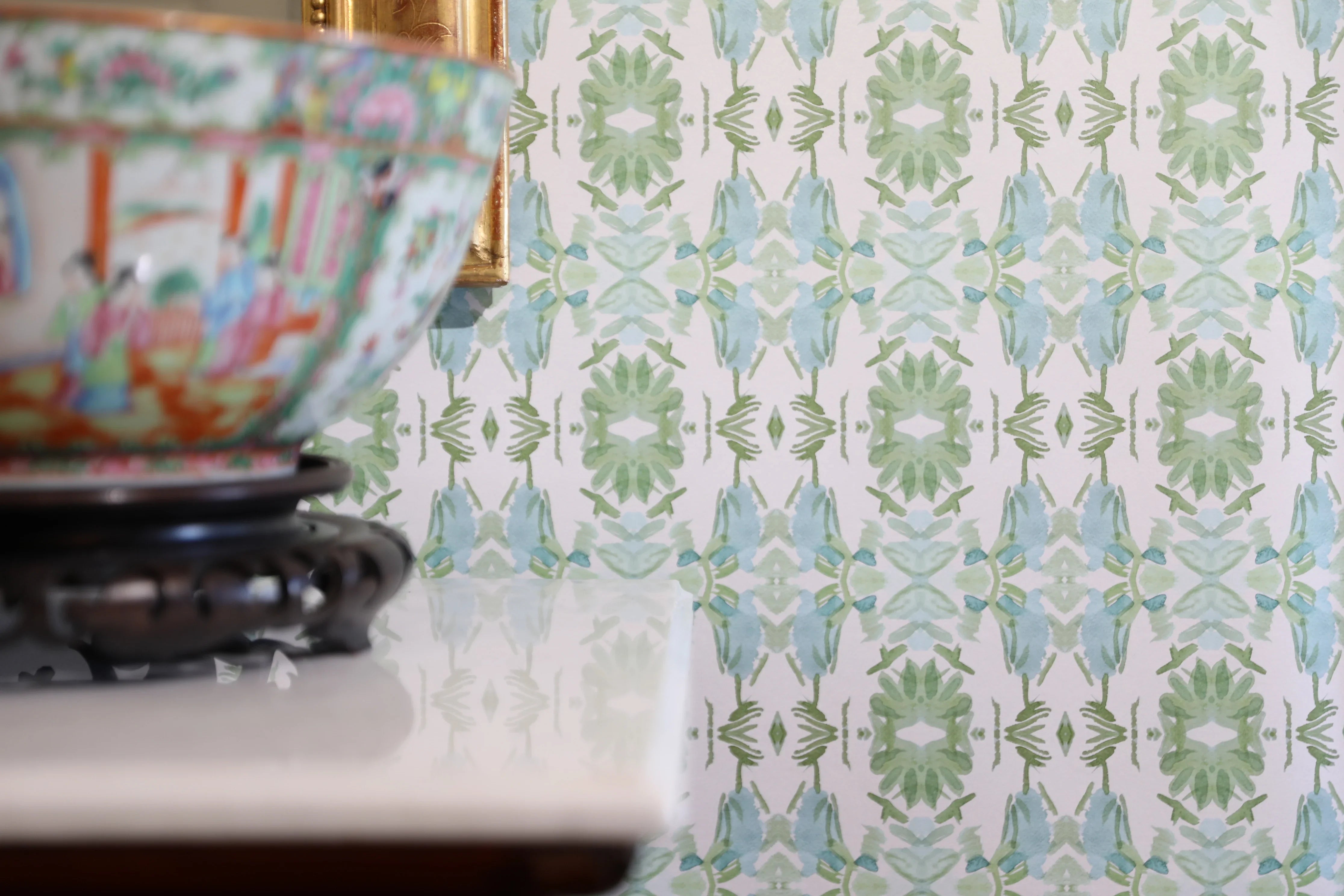 Luxury botanical wallpaper featuring an artistic wildflower-inspired pattern in sage green and soft blue, designed for modern traditional interiors, powder rooms, bedrooms, dining rooms, and collected homes.