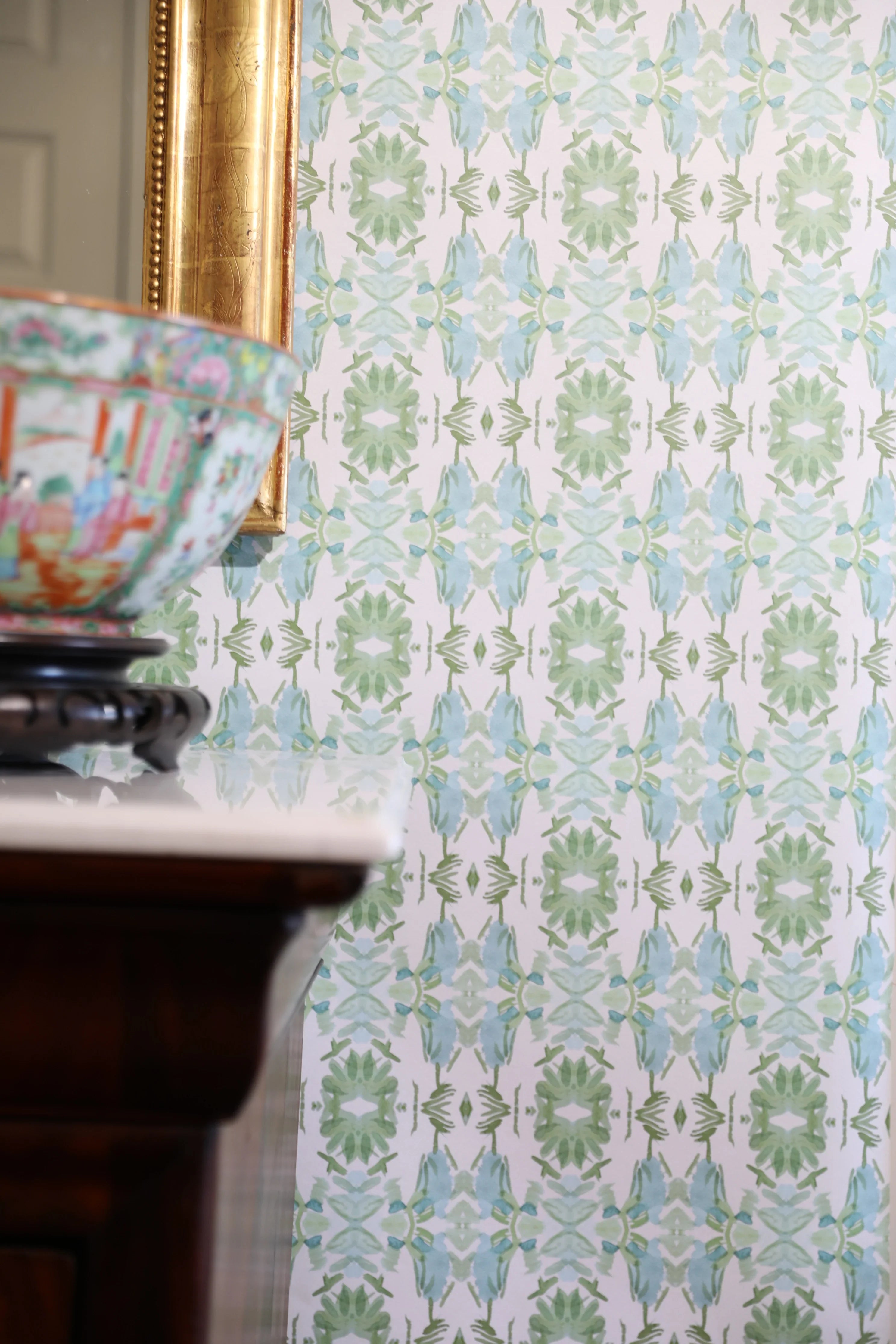 Luxury botanical wallpaper featuring an artistic wildflower-inspired pattern in sage green and soft blue, designed for modern traditional interiors, powder rooms, bedrooms, dining rooms, and collected homes.