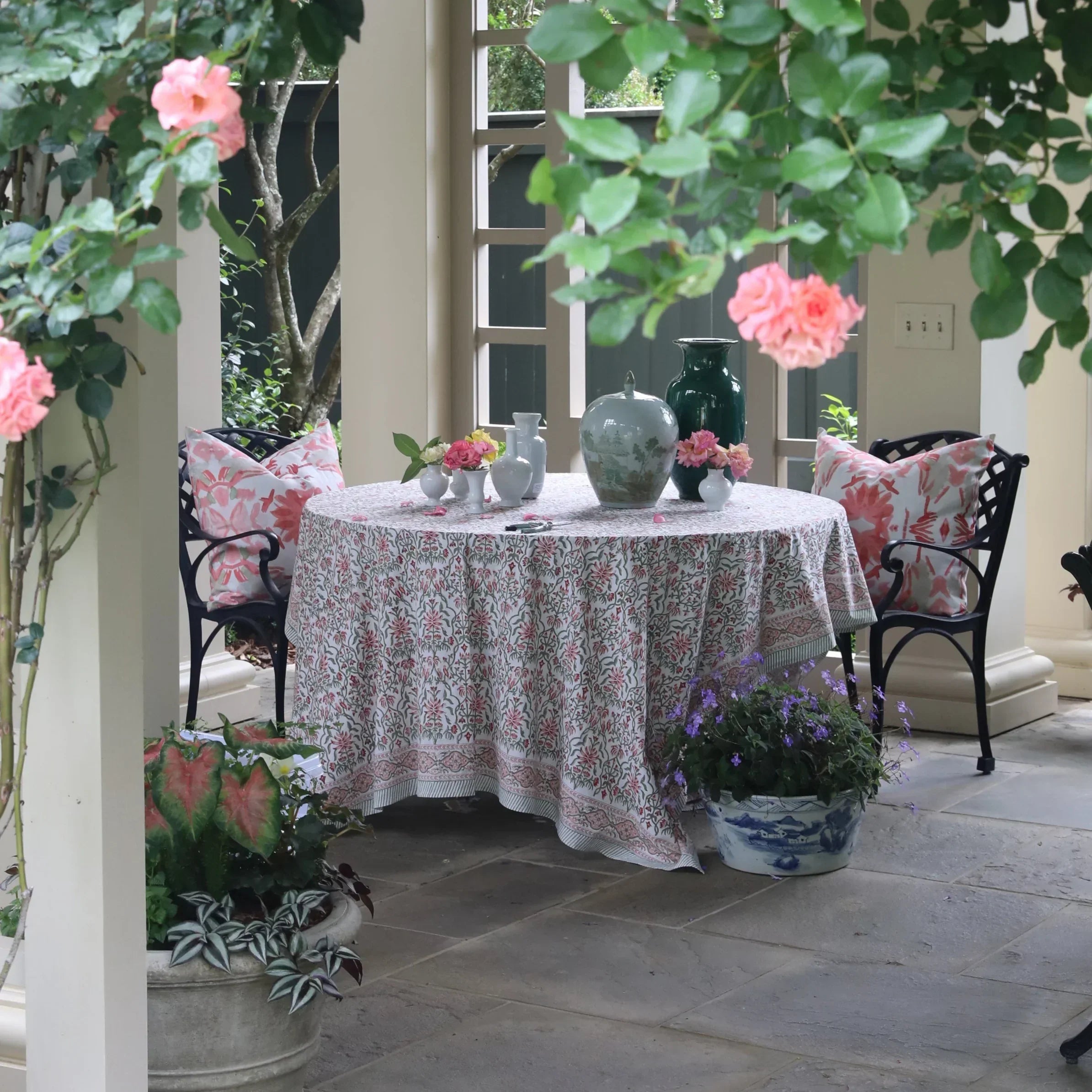 Wildflowers I Strawberry luxury decorative pillow featuring a large-scale abstract floral pattern in rich strawberry pink and red tones, handcrafted in England for luxury living rooms, designer-curated interiors, layered bedrooms, and modern traditional homes.