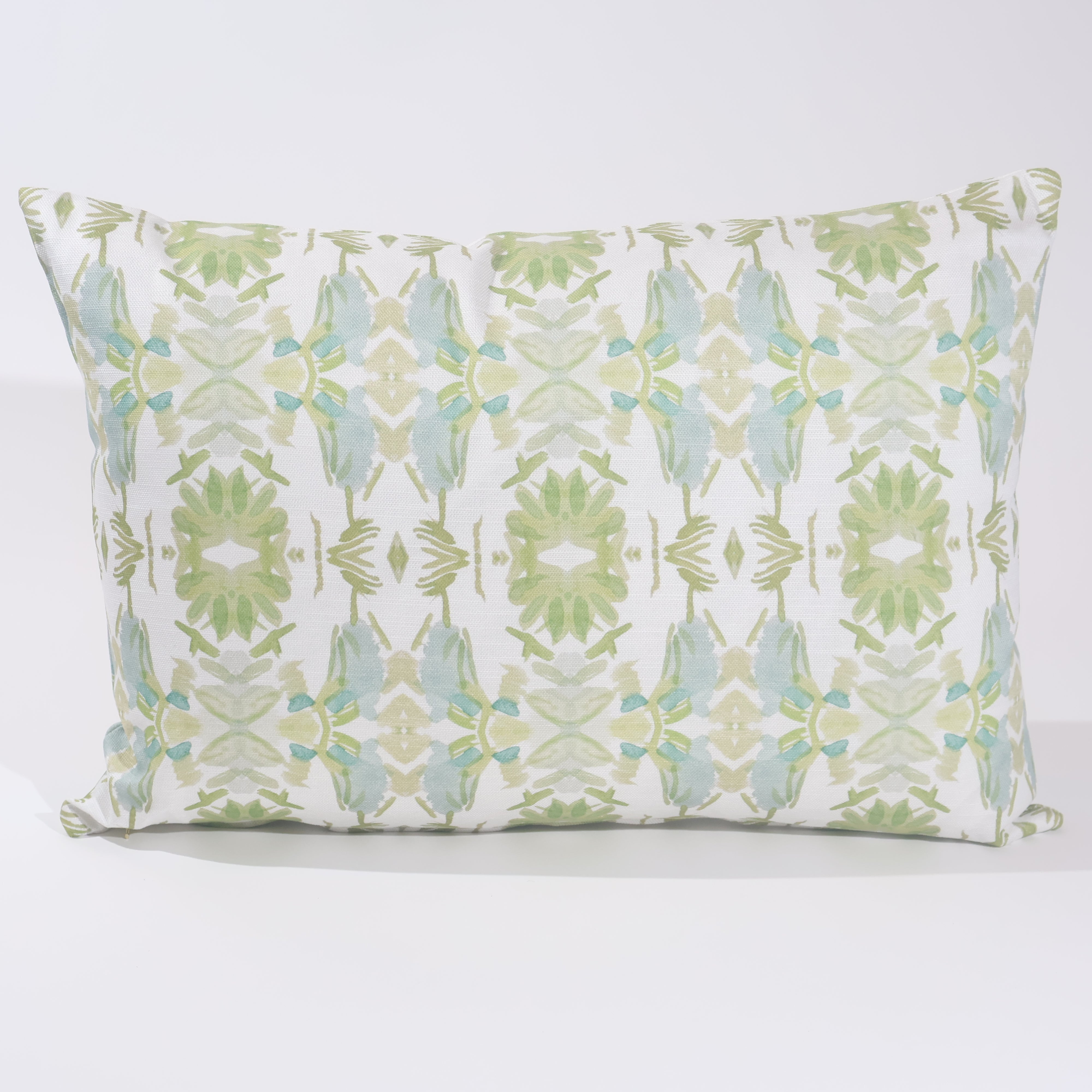 Wildflowers I White & Apple Green luxury pillow featuring an artistic floral pattern on a soft white ground, handcrafted in England for traditional, modern traditional, and layered interior design projects.