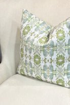 Wildflowers I White & Apple Green luxury pillow featuring an artistic floral pattern on a soft white ground, handcrafted in England for traditional, modern traditional, and layered interior design projects.