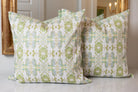 Wildflowers I White & Apple Green luxury pillow featuring an artistic floral pattern on a soft white ground, handcrafted in England for traditional, modern traditional, and layered interior design projects.