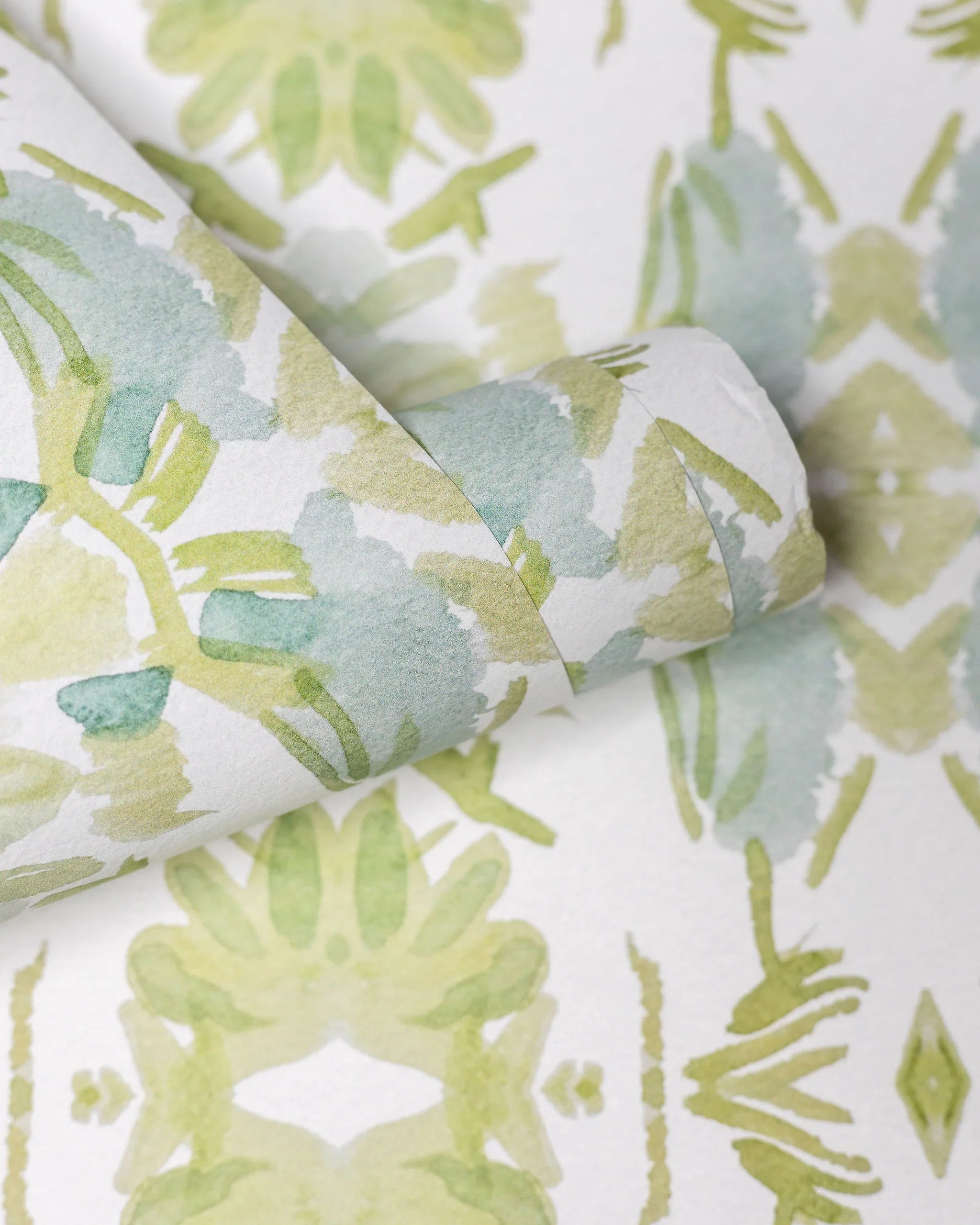 Wildflowers I White & Apple Green luxury wallpaper featuring an abstract floral pattern on a soft white ground with fresh apple green tones, sustainably printed in England for luxury homes, designer-curated interiors, powder rooms, bedrooms, and thoughtfully layered living spaces.