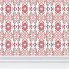 Luxury floral wallpaper featuring an artistic wildflower pattern in strawberry pink, blush, and soft green tones, designed for modern traditional interiors, bedrooms, powder rooms, and collected homes.